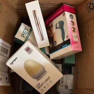 Box of SURPRISES AND BEAUTY- pet shaver, eyebrow cutters, lighters,
